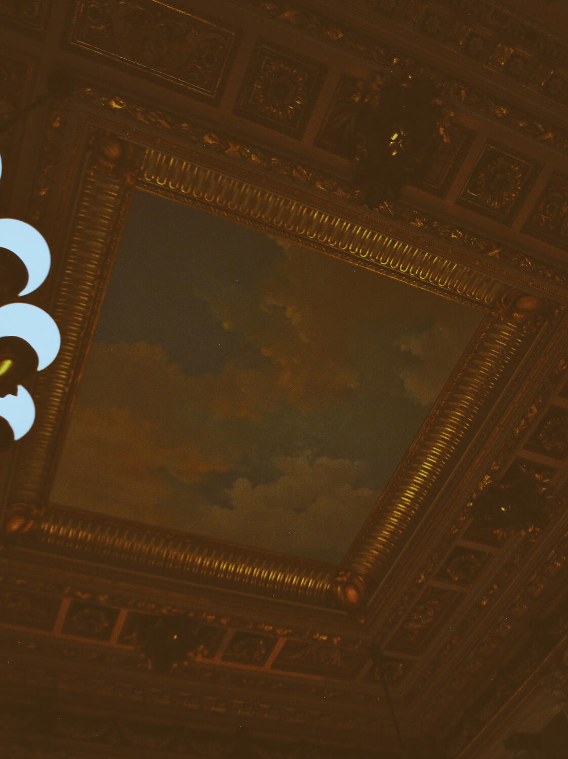 Lighting and ceiling at The Breakers mansion in Newport, Rhode Island.