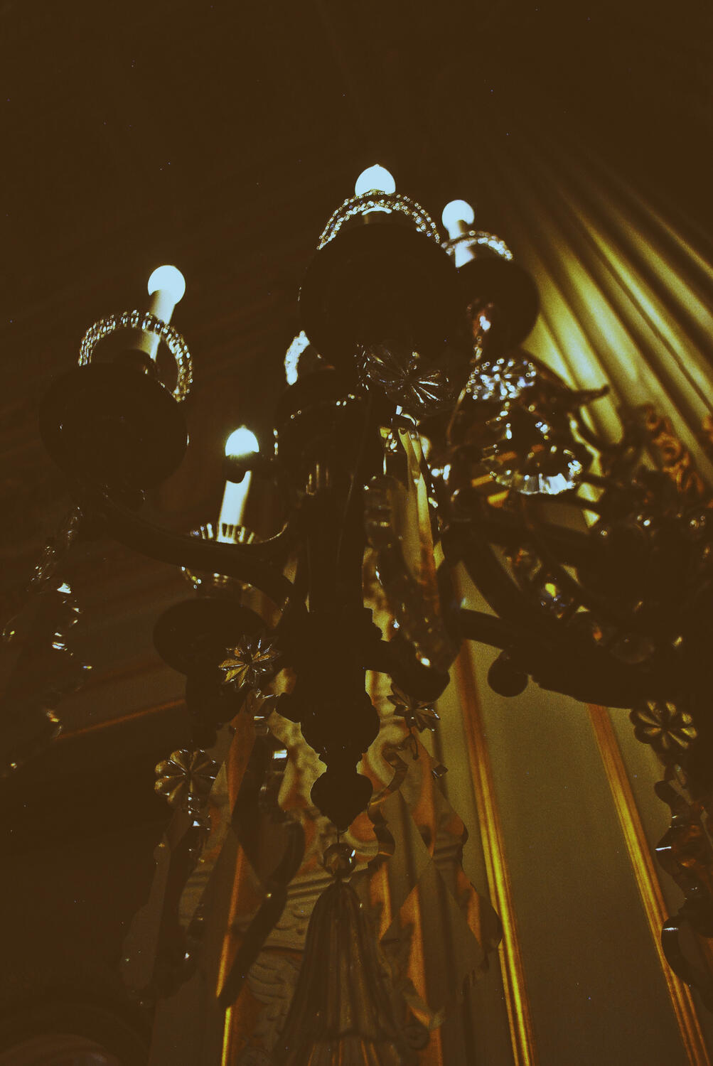 A moody chandelier at The Breakers mansion in Newport, Rhode Island.
