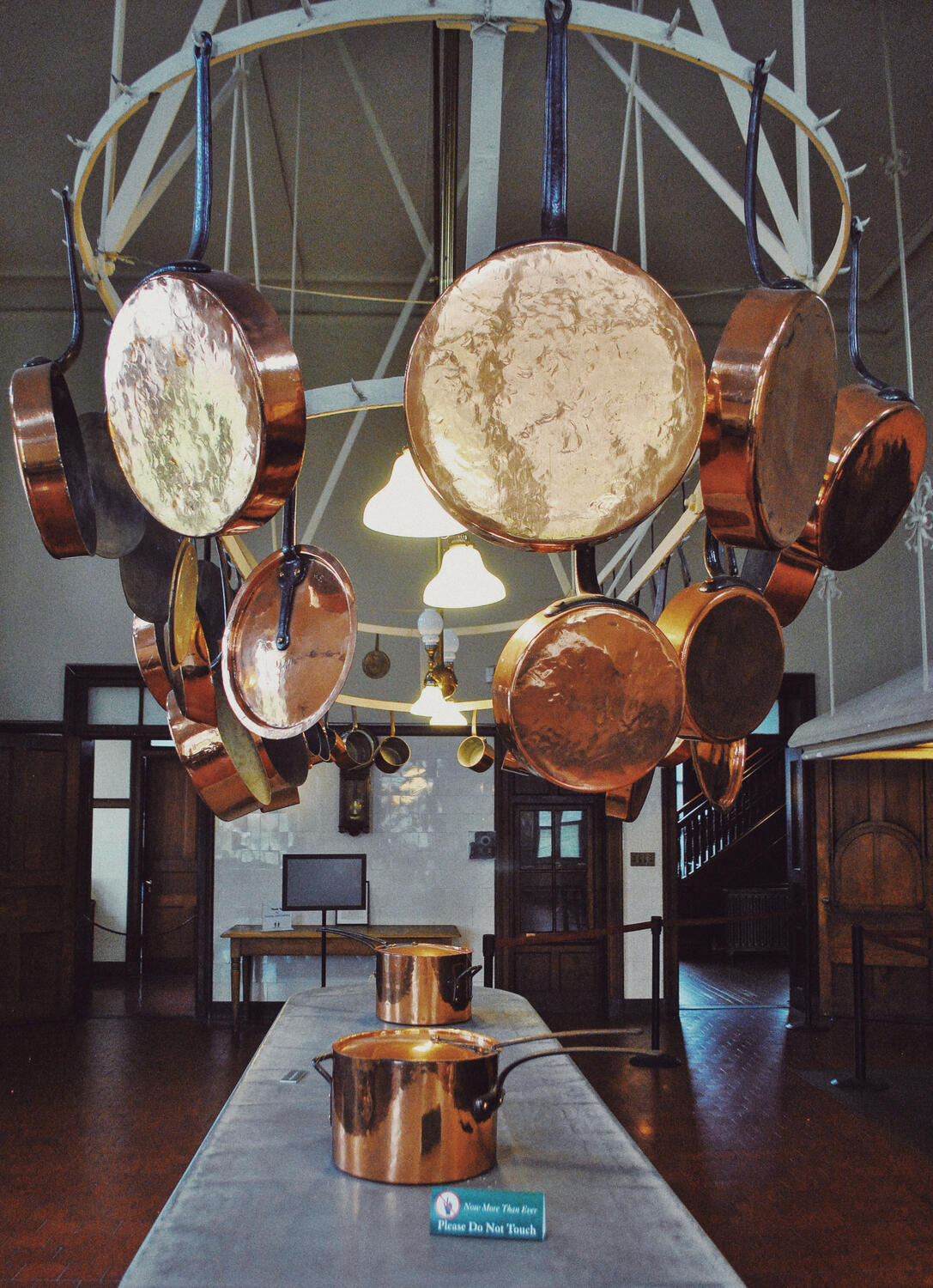 Huge hanging copper pots and pans in the kitchen at The Breakers mansion in Newport, Rhode Island.